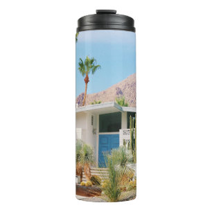 WHITE AND BLUE CONCRETE BUILDING NEAR GREEN TREES  THERMAL TUMBLER