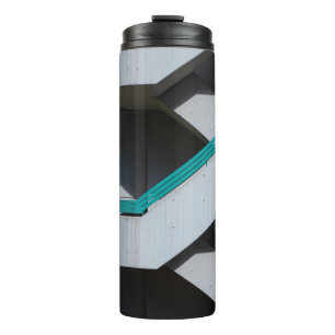 WHITE AND BLUE CONCRETE BUILDING THERMAL TUMBLER