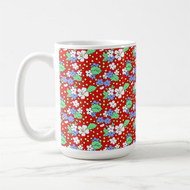 White and blue flowers on red coffee mug (Left)