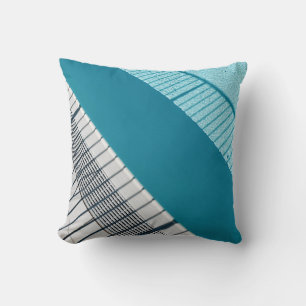 White and blue striped textile cushion