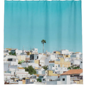 White and brown concrete houses under blue sky in shower curtain