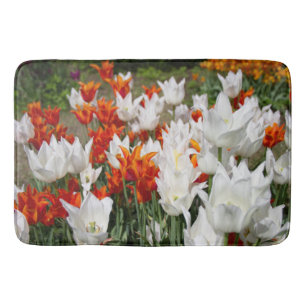White and ginger tulips in the garden    bath mat