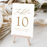 White and Gold Modern Elegance Wedding Table Number<br><div class="desc">Trendy, minimalist wedding table number cards featuring gold modern lettering with "Table" in modern calligraphy script. The design features a white background or a colour of your choice. The design repeats on the back. To order the table cards: add your name, wedding date, and table number. Add each number to...</div>