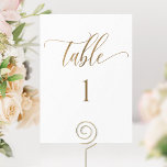 White and Gold Modern Minimalist Table Number<br><div class="desc">Help your guests find their table with this elegant modern white and gold table number. Double-sided cards. Clear space all around gives you the liberty to use a table holder or frame. Attractive "table" in modern handwritten calligraphy in faux gold foil print. Background colour in white, which can be changed...</div>