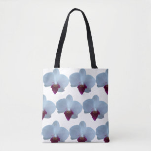 White and purple orchids on an all over print tote bag