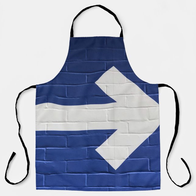 White arrow painted on brick wall apron (Front)
