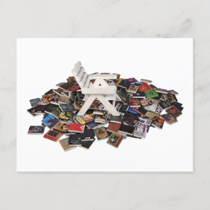 White Beach Chair on a pile of books Postcard