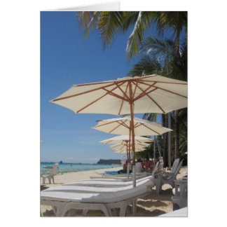 white beach umbrella lounges