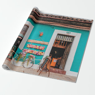 WHITE BICYCLE PARKED BESIDE TEAL PAINTED CONCRETE  WRAPPING PAPER
