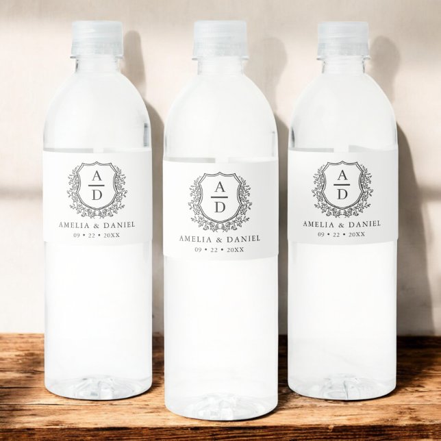 White Black Monogram Wedding Floral Crest Water Bottle Label (Creator Uploaded)