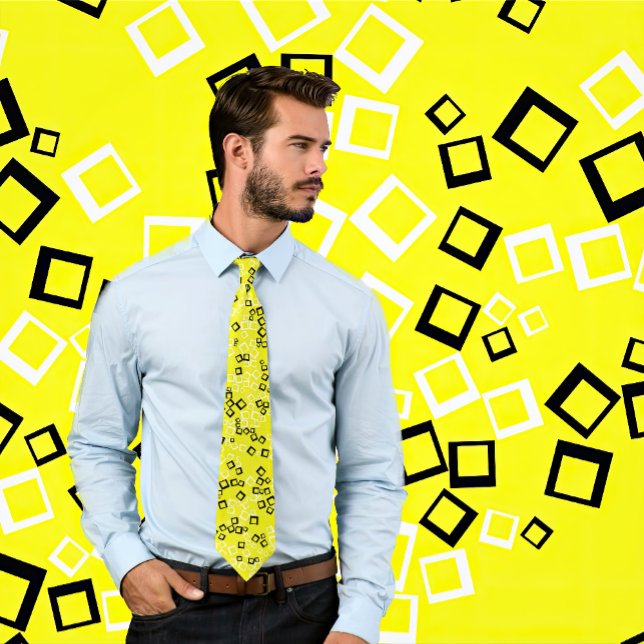 White & Black Retro Squares on Neon Yellow Tie (Man wears a necktie with a yellow tie with a retro, black and white pattern. Background matches tie.)