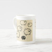 White & Black Sheep on Cream Background