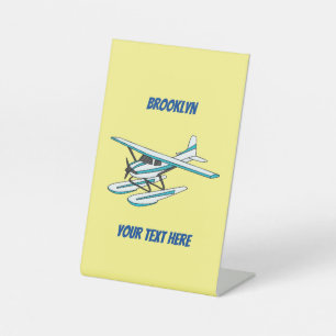 White blue seaplane illustration pedestal sign