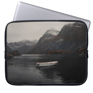WHITE BOAT ON BODY OF WATER NEAR MOUNTAINS LAPTOP SLEEVE