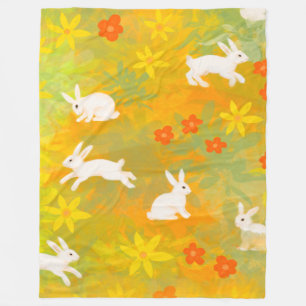 White bunnies on a flower filed fleece blanket
