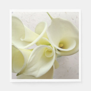 White calla lilies from above napkin