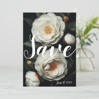 White camellias on a dark background