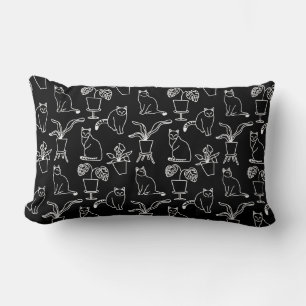 White cats on black lumbar cushion