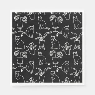 White cats on black napkin