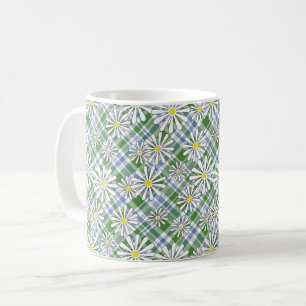 White chamomile flowers on a green blue chequered coffee mug