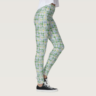 White chamomile flowers on a green blue chequered leggings