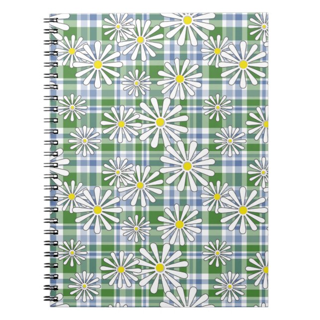 White chamomile flowers on a green blue chequered  notebook (Front)
