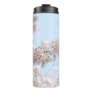 White cherry blossom under clear blue sky in the m thermal tumbler