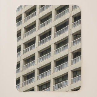 White concrete building during daytime sherpa blanket