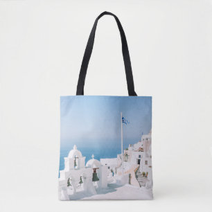 White concrete building near body of water in the  tote bag