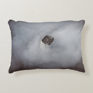 WHITE CONCRETE BUILDING SURROUNDED BY CLOUDS DECORATIVE CUSHION