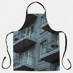 WHITE CONCRETE BUILDING WITH WHITE METAL RAILINGS APRON