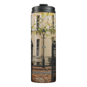WHITE CONCRETE HOUSE SURROUNDED BY TREES DURING DA THERMAL TUMBLER