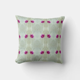 white, cream background with hot pink pattern cushion