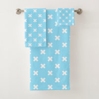 White cross stitches on baby blue