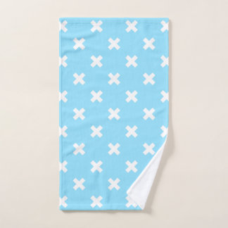 White cross stitches on baby blue hand towel