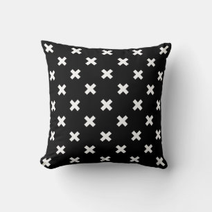 White cross stitches on black cushion