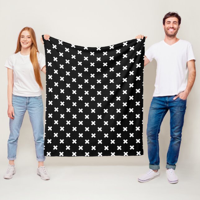 White cross stitches on black fleece blanket (In Situ)