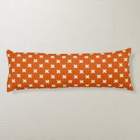 White cross stitches on burnt orange