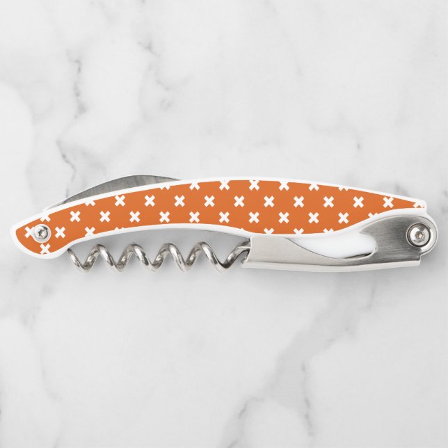 White cross stitches on burnt orange corkscrew (Back)