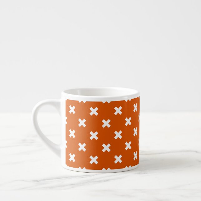 White cross stitches on burnt orange espresso cup (Left)