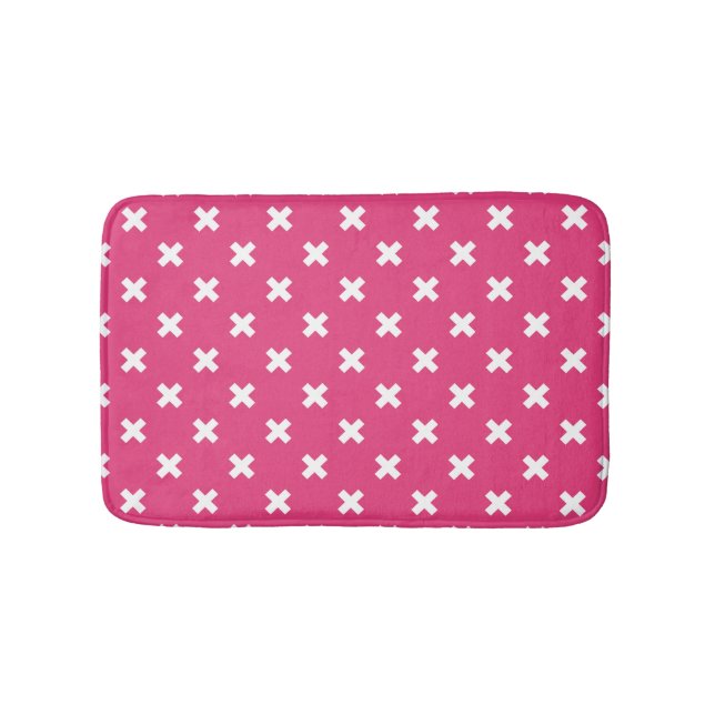 White cross stitches on fuchsia bath mat (Front)
