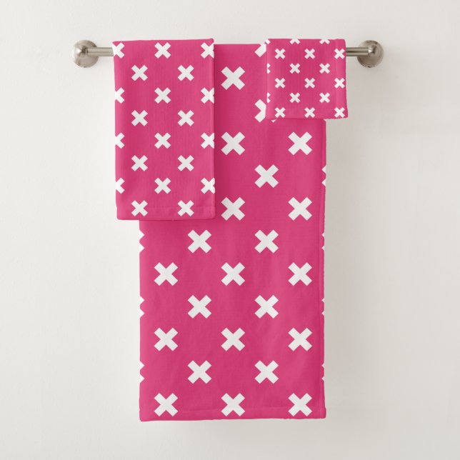 White cross stitches on fuchsia bath towel set (Insitu)
