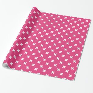 White cross stitches on fuchsia wrapping paper