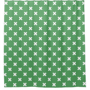 White cross stitches on green shower curtain
