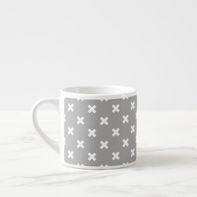 White cross stitches on grey espresso cup (Left)