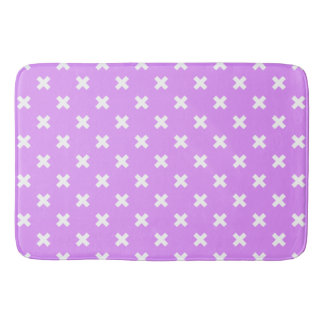White cross stitches on lilac bath mat