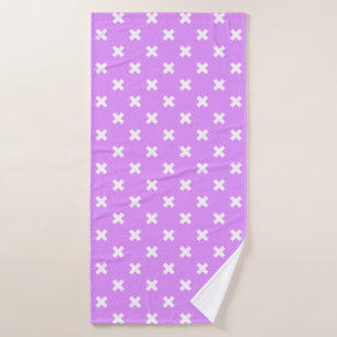 White cross stitches on lilac bath towel