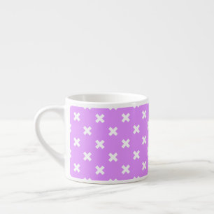 White cross stitches on lilac espresso cup