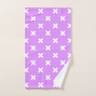 White cross stitches on lilac hand towel