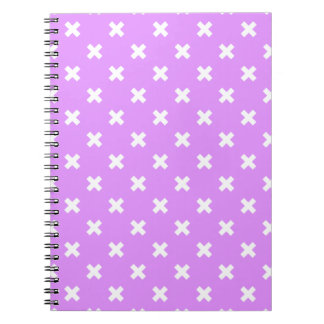White cross stitches on lilac notebook